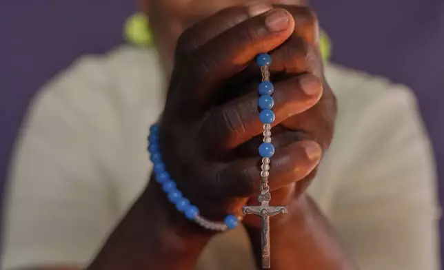 Mercyline Bunoro, 64, mother of seven, sits for a portrait In Nairobi, Kenya, on Friday, Oct. 11, 2024. (AP Photo/Brian Inganga)