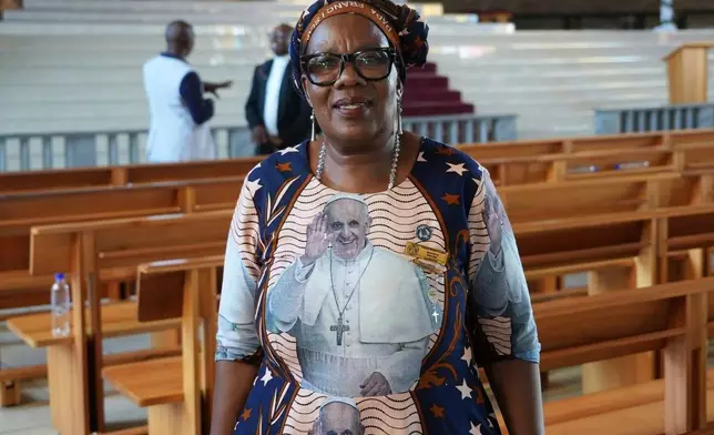 Beatrice Rakoma, 64, who lives in the Alexandra township of Johannesburg, South Africa, stands for a portrait after attending a memorial service for Pope Francis at the Regina Mundi Catholic Church in Soweto on Thursday May 1, 2025. (AP Photo/Alfonso Nqunjana)