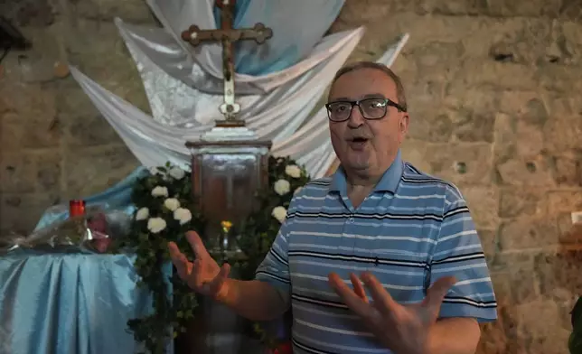 Bernard Anka, 65, a Lebanese Maronite Catholic an owner of a grocery shop in Beirut's predominantly Christian district of Gemayze, speaks during an interview with the associated press, in Beirut, Lebanon, Monday, May 5, 2025. (AP Photo/Hussein Malla)
