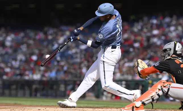 Washington Nationals' James Wood hits a two-run home run during the first inning of a baseball game against the San Francisco Giants, Saturday, May 24, 2025, in Washington. (AP Photo/Nick Wass)