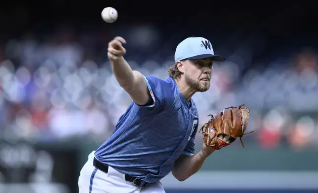 Washington Nationals starting pitcher Jake Irvin throws during the first inning of a baseball game against the San Francisco Giants, Saturday, May 24, 2025, in Washington. (AP Photo/Nick Wass)