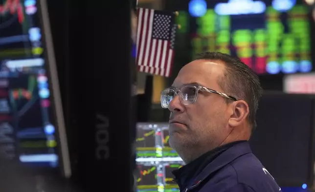 Specialist Anthony Matesic works at his post on the floor of the New York Stock Exchange, Wednesday, May 7, 2025. (AP Photo/Richard Drew)