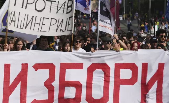 University students and people march during a protest, seven months after the deadly train station tragedy that sparked mass demonstrations against corruption in Belgrade, Serbia, Friday, May 30, 2025. (AP Photo/Darko Vojinovic)