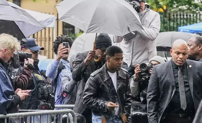 Rapper Kid Cudi, center, arrives at Federal Court for the trial of Sean "Diddy" Combs, in New York, Thursday, May 22, 2025. (AP Photo/Richard Drew)