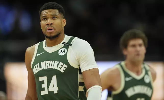 FILE - Milwaukee Bucks' Giannis Antetokounmpo looks on during the first half of an NBA basketball game against the Minnesota Timberwolves, Tuesday, April 8, 2025, in Milwaukee. (AP Photo/Aaron Gash, File)