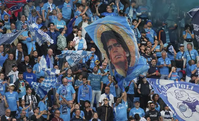 Napoli fans wait for the start of the Italian Serie A soccer match between Napoli and Cagliari in Naples, Italy, Friday, May 23, 2025. (AP Photo/Gregorio Borgia)