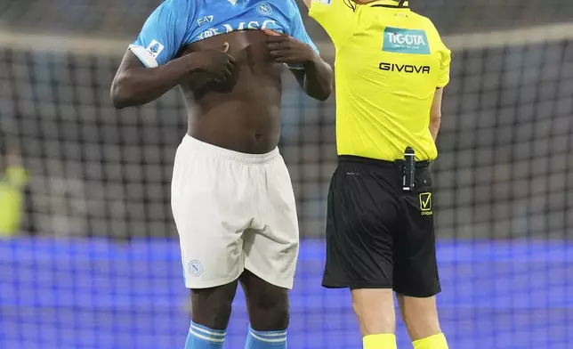 Napoli's Romelu Lukaku gets a yellow card during the Italian Serie A soccer match between Napoli and Cagliari at the Diego Maradona stadium in Naples, Italy, Friday, May 23, 2025. (AP Photo/Gregorio Borgia)