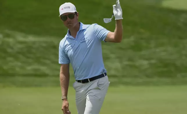 Ben Griffin reacts after sinking his shot on the 18th green during the first round of the Memorial golf tournament Thursday, May 29, 2025, in Dublin, Ohio. (AP Photo/Sue Ogrocki)
