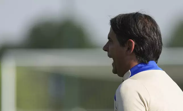 Inter Milan's head coach Simone Inzaghi shouts during a training session of the Champions League Media Day in view of the Saturday's Champions League final against PSG, at the Inter Milan training center, in Appiano Gentile, Italy, Monday, May. 26, 2025. (AP Photo/Antonio Calanni)
