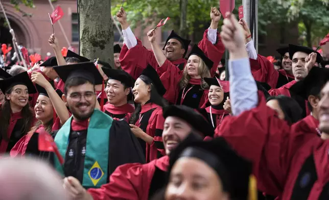 Students cheer during Harvard University's commencement ceremonies, Thursday, May 29, 2025 in Cambridge, Mass. (AP Photo/Charles Krupa)