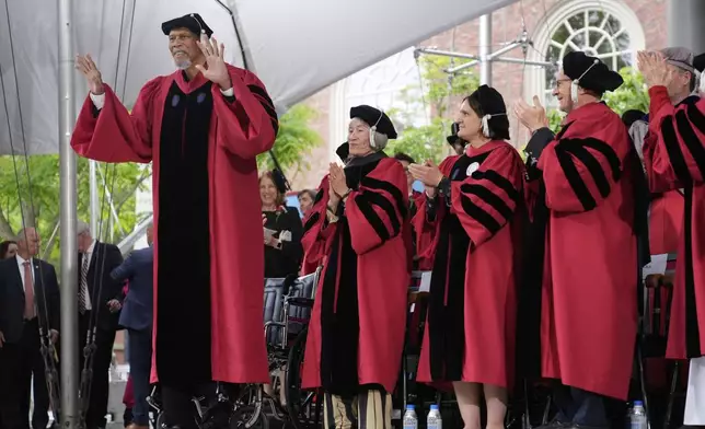 Hall of Fame center and honorary degree recipient Kareem Abdul-Jabbar acknowledges the audience applause during commencement ceremonies at Harvard University, Thursday, May 29, 2025, in Cambridge, Mass. (AP Photo/Charles Krupa)