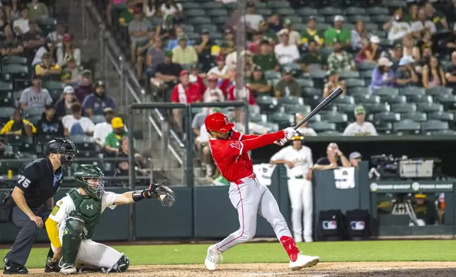 Los Angeles Angels' Matthew Lugo hits during the eighth inning of a baseball game against the Athletics in West Sacramento, Calif., Wednesday, May 21, 2025. (AP Photo/Nic Coury)