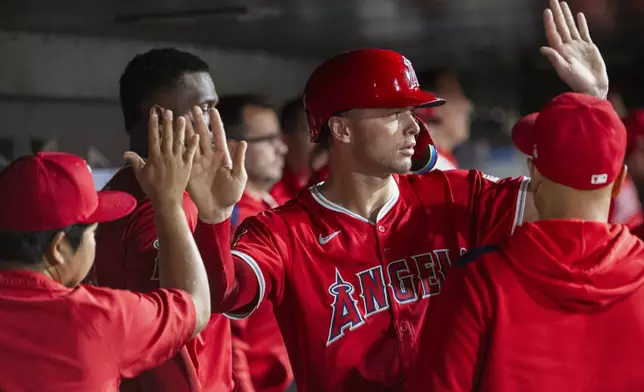 Los Angeles Angels' Logan O'Hoppe celebrates after scoring during the eighth inning of a baseball game against the Athletics in West Sacramento, Calif., Wednesday, May 21, 2025. (AP Photo/Nic Coury)