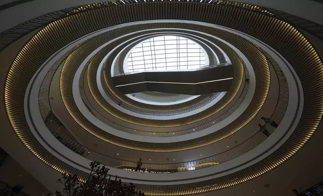 People watch a security mock drill at a mall in Ahmedabad, India, Wednesday, May 7, 2025, amid rising fears of wider conflict following India's strikes in Pakistan. (AP Photo/Ajit Solanki)