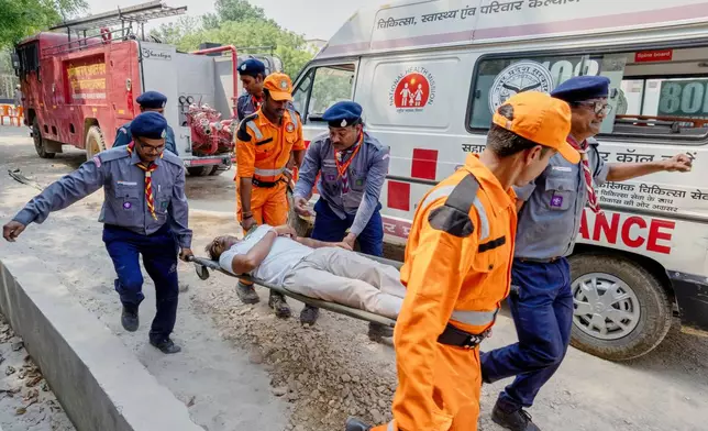 Uttar Pradesh State Disaster Response Force and Civil Defence personnel participate in a mock security drill on the outskirts of Prayagraj, India, Wednesday, May 7, 2025 amid rising fears of wider conflict following India’s strikes in Pakistan. (AP Photo/Rajesh Kumar Singh)