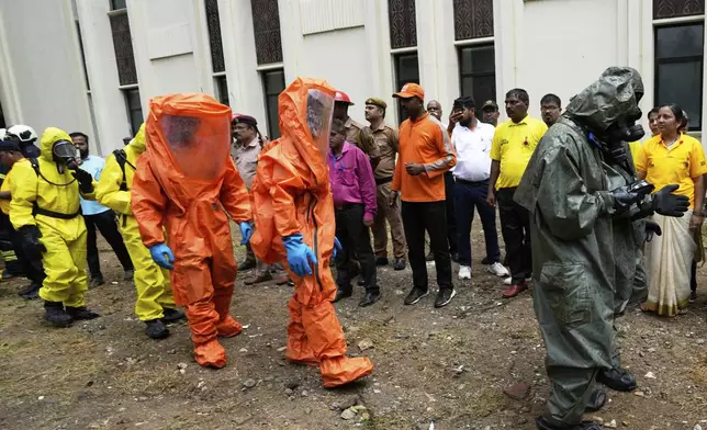 Civil Defense Services, National Disaster Response Force NDRF and Mumbai Fire Brigade workers take part in a mock drill in Mumbai, India, Wednesday, May 7, 2025, amid rising fears of wider conflict following India's strikes in Pakistan. (AP Photo/Rajanish Kakade)