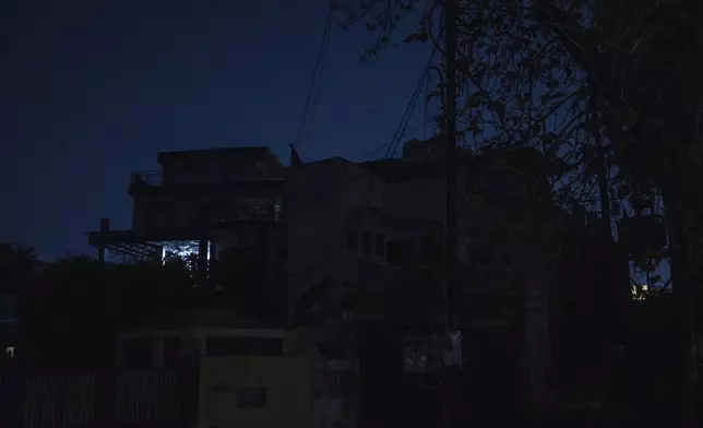 A blackout is seen during a mock drill to train civilians in case of attack in Prayagraj, India, Wednesday, May 7, 2025 amid rising fears of wider conflict following India's strikes in Pakistan. (AP Photo/Rajesh Kumar Singh)