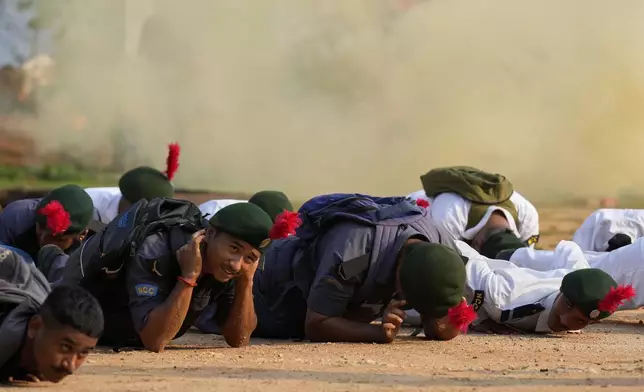 National Cadet Corps members participate during a mock drill to train civilians and security personnel to respond in case of attack, in Guwahati, India, Wednesday, May 7, 2025 amid rising fears of wider conflict following India's strikes in Pakistan. (AP Photo/Anupam Nath)