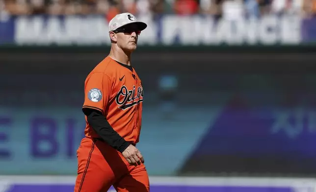 Baltimore Orioles interim manager Tony Mansolino walks off the field after removing pitcher Kyle Gibson during the first inning of a baseball game against the Washington Nationals in Baltimore, Saturday, May 17, 2025. (AP Photo/Terrance Williams)