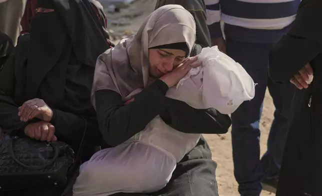 FILE- Heba Shakura mourns her son Islam Abu Mahdi who was killed in an Israeli army airstrike, during his funeral at the Indonesian hospital in Beit Lahia, northern Gaza Strip, Monday, April 28, 2025. (AP Photo/Jehad Alshrafi,File)