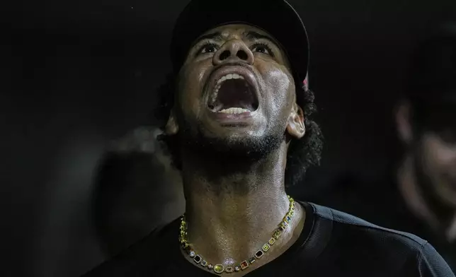 Cincinnati Reds pitcher Hunter Greene reacts in the dugout after striking out Washington Nationals' Keibert Ruiz swinging for the third out of the sixth inning of a baseball game, Friday, May 2, 2025, in Cincinnati. (AP Photo/Carolyn Kaster)