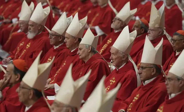 Cardinal Matteo Zuppi, centre, attends a mass on the third of nine days of mourning for late Pope Francis, in St. Peter's Basilica at the Vatican, Monday, April 28, 2025. (AP Photo/Andrew Medichini)