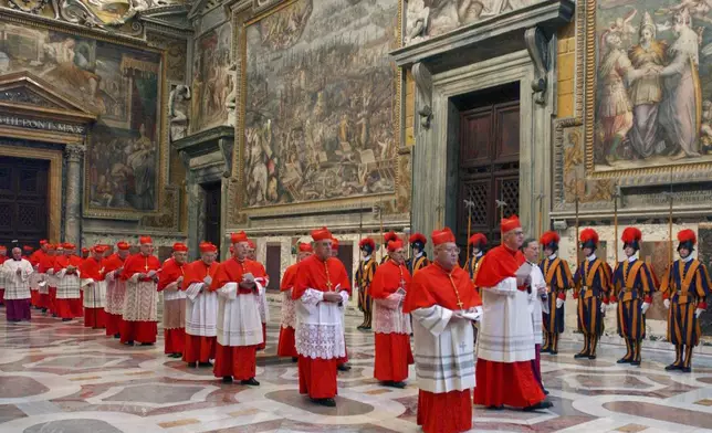 FILE - Cardinals walk in procession to the Sistine Chapel at the Vatican, at the beginning of the conclave, April 18, 2005. (Osservatore Romano via AP, File)