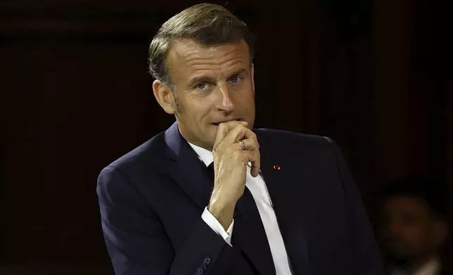 French President Emmanuel Macron attends the "Choose Europe for Science" event, to encourage researchers and scientists from all over the world to practice in Europe, at the Sorbonne University in Paris, Monday, May 5, 2025.(Gonzalo Fuentes/Pool via AP)