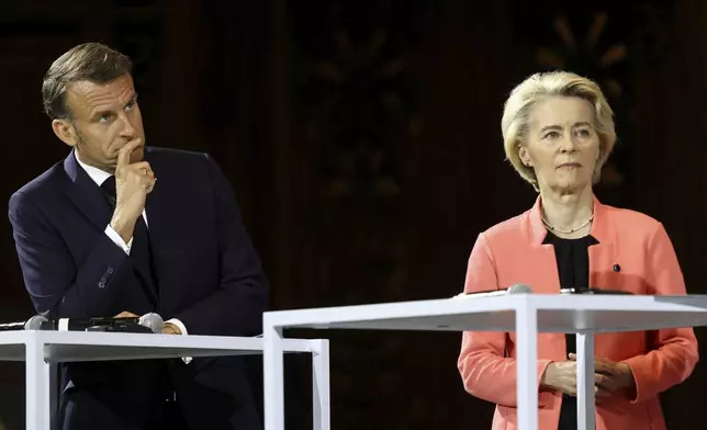 French President Emmanuel Macron and European Commission President Ursula Von der Leyen attend the "Choose Europe for Science" event, to encourage researchers and scientists from all over the world to practice in Europe, at the Sorbonne University in Paris, Monday, May 5, 2025.(Gonzalo Fuentes/Pool via AP)