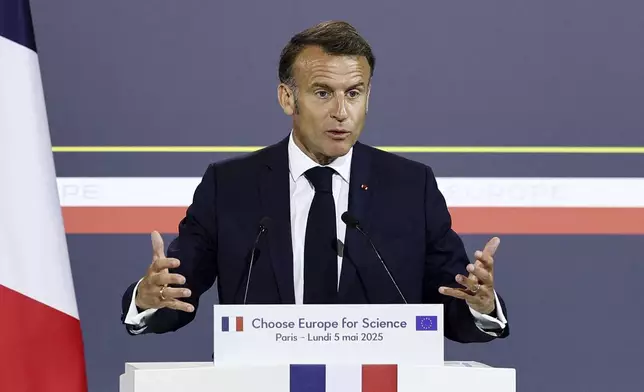 French President Emmanuel Macron delivers his speech at the "Choose Europe for Science" event, to encourage researchers and scientists from all over the world to practice in Europe, at the Sorbonne University in Paris, Monday, May 5, 2025.(Gonzalo Fuentes/Pool via AP)