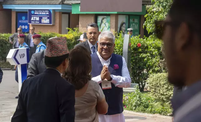 An Indian delegate arrives to participate in an environment conference named Sagarmatha Sambaad (Mount Everest Dialogue) in Kathmandu, Nepal, Friday, May 16, 2025. (AP Photo/Niranjan Shrestha)