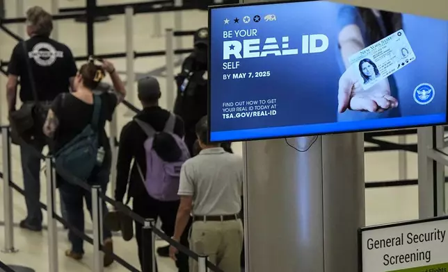 FILE - Travelers move through Hartsfield-Jackson Atlanta International Airport ahead of Memorial Day, Friday, May 24, 2024, in Atlanta.(AP Photo/Mike Stewart, File)