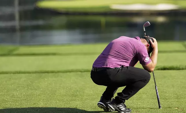 Tyrrell Hatton, of England, reacts to his tee shot on the 17th hole during the first round of the PGA Championship golf tournament at the Quail Hollow Club, Thursday, May 15, 2025, in Charlotte, N.C. (AP Photo/David J. Phillip)