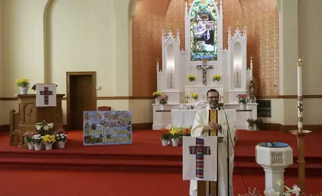 The Rev. Hierald Osorto speaks to the congregation of St. Paul’s-San Pablo Lutheran Church, which holds wellness sessions after Sunday worship in the sanctuary as part of its migrant ministry, in Minneapolis, Sunday, April 27, 2025. (AP Photo/Giovanna Dell’Orto)