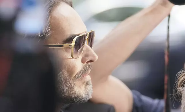 Russell Brand arrives at Westminster Magistrates' court in London, Friday, May 2, 2025, where he faces, rape and sexual assault charges involving four women. (AP Photo/Alberto Pezzali)