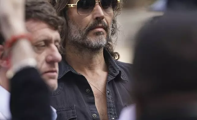 Russell Brand arrives at Westminster Magistrates' court in London, Friday, May 2, 2025, where he faces, rape and sexual assault charges involving four women. (AP Photo/Alberto Pezzali)