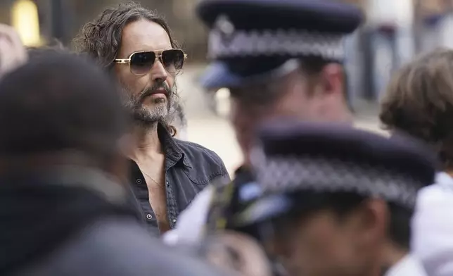 Russell Brand arrives at Westminster Magistrates' court in London, Friday, May 2, 2025, where he faces, rape and sexual assault charges involving four women. (AP Photo/Alberto Pezzali)