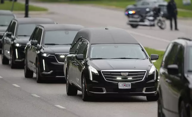 A funeral procession leaves Congregation Beth Torah after a funeral for Sarah Milgrim, a staffer at the Israeli Embassy who was killed last week outside a Washington Jewish museum, Tuesday, May 27, 2025, in Overland Park, Kan. (AP Photo/Charlie Riedel)
