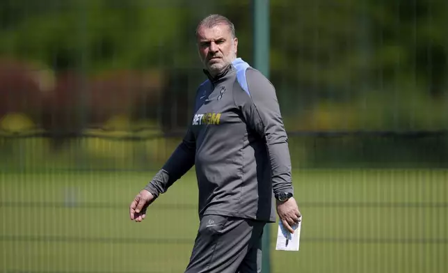 Tottenham Hotspur manager Ange Postecoglou looks on during a training session at Tottenham Hotspur Training Centre, London, Monday May 12, 2025. (Ben Whitley/PA via AP)