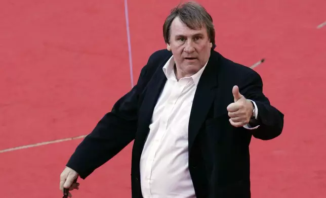 FILE - French actor Gerard Depardieu poses for photographers on the red carpet of the Rome Film Festival, on Oct. 21, 2007. (AP Photo/Riccardo De Luca, File)