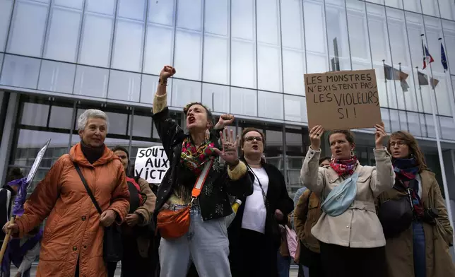 FILE - Women's rights activists demonstrate outside the Paris palace of justice as French actor Gérard Depardieu is facing trial for the alleged sexual assaults of two women on a film set in 2021, on Oct. 28, 2024 in Paris. (AP Photo/Louise Delmotte, File)