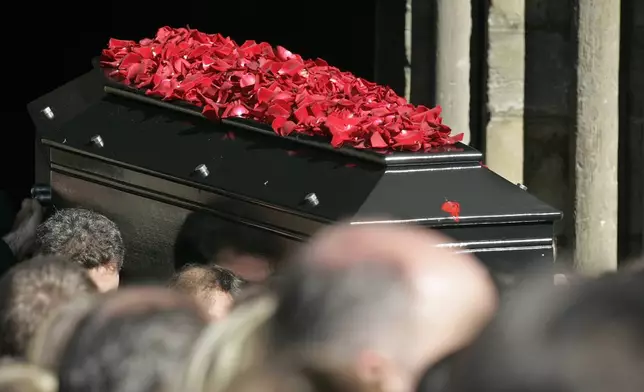 FILE - The coffin of late French actor Guillaume Depardieu is being carried out of the church after the funeral ceremony for Guillaume Depardieu in Bougival, west of Paris, Friday, Oct. 17, 2008. (AP Photo/Michel Euler, File)