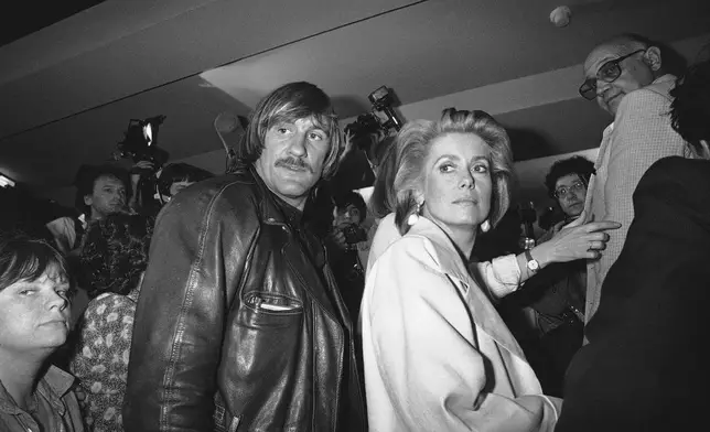FILE - Actors Gerard Depardieu and Catherine Deneuve are seen in Cannes, southern France, on May 11 1984. (AP Photo/Michel Lipchitz, File)