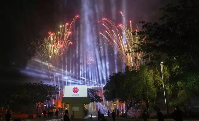 Fireworks are launched for the first graduation for The American University of Iraq - Baghdad in Baghdad, Iraq, Saturday, May 24, 2025. (AP Photo/Hadi Mizban)