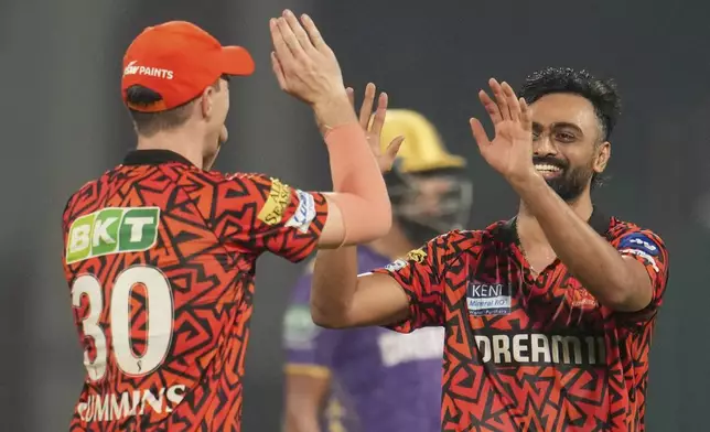 Sunrisers Hyderabad's Jaydev Unadkat, right, celebrates with captain Pat Cummins the dismissal of Kolkata Knight Riders' Manish Pandey during the Indian Premier League cricket match between Kolkata Knight Riders and Sunrisers Hyderabad at Arun Jaitley Stadium in New Delhi, India, Sunday, May 25, 2025. (AP Photo/Manish Swarup)