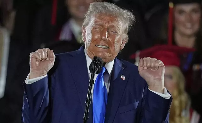 President Donald Trump talks about transgender weightlifters as gives a commencement address at the University of Alabama, Thursday, May 1, 2025, in Tuscaloosa, Ala. (AP Photo/Mike Stewart)