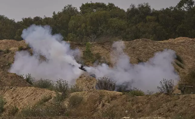 An Israeli mobile artillery unit fires a shell from southern Israel towards the Gaza Strip, in a position near the Israel-Gaza border on Tuesday, May 6, 2025. (AP Photo/Ohad Zwigenberg)
