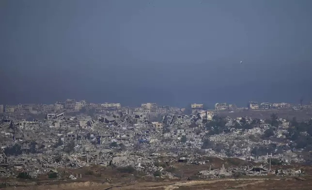 Destroyed buildings in the Gaza Strip as seen from southern Israel, Tuesday, May 6, 2025. (AP Photo/Ohad Zwigenberg)
