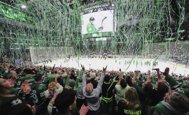 Dallas Stars' Mikko Rantanen is shown on the large video board as fans celebrate the Stars 4-2 win against the Colorado Avalanche in Game 7 of a first-round NHL hockey playoff series Saturday, May 3, 2025, in Dallas. (AP Photo/Julio Cortez)