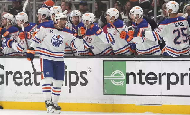 Edmonton Oilers left wing Evander Kane celebrates his goal with teammates during the second period in Game 5 of an NHL hockey first-round playoff series against the Los Angeles Kings, Tuesday, April 29, 2025, in Los Angeles. (AP Photo/Mark J. Terrill)